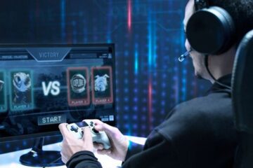 a human player playing a futuristic game on the computer against AI, implying web3 gaming and AI technology advancements