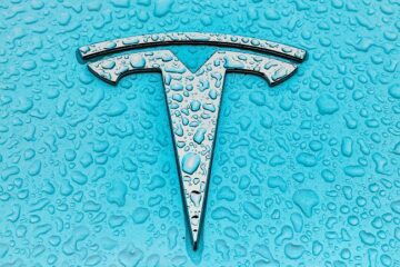 Tesla logo over cian